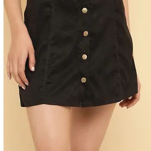 A line buttoned black skirt