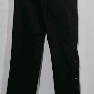 Flared Black Jeans With Cut Design