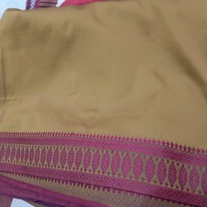 A MUSTARD RED SAREE (WITH BLOUSE..)