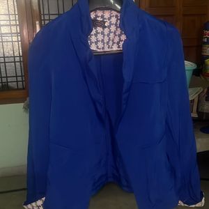 A blue office wear Jacket or  coat