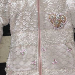 baby pink fur jacket with net and pearl details