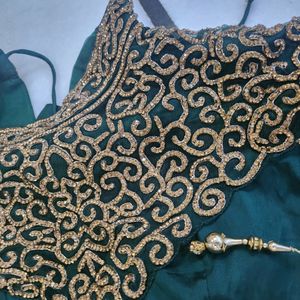 Luxurious Silk Dark Green Gown With Golden Stone