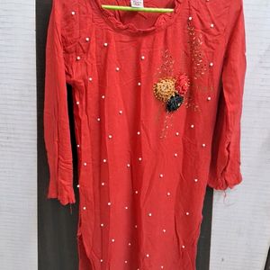 A Beautiful Red Kurta With White Pearls