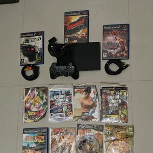 PS2 Console With 11 CD's (Non Working)