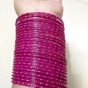 A Beautiful Rani Pink Colour Bangles With Golden