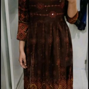 Designer Brown Gown, With A Mirror Work And Detailed Fabric