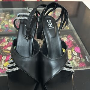 Love in black shimmer strap heels