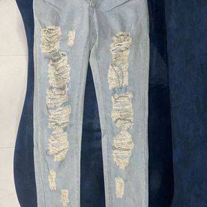 Distressed Jeans With Chain Detail