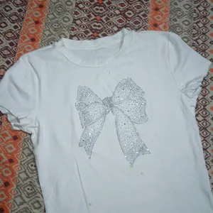 Embellished And Trendy Bow Top.