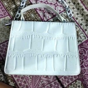 white hand purse