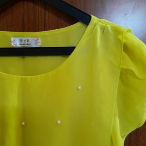 yellow cinched waist top