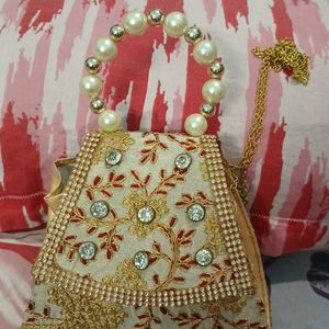 Small Clutch With Stone And Golden Embroidery Work