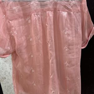 A Pretty Peach Top With Delicate Embroidered Motif