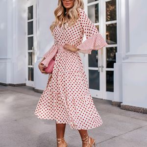 Three tiered orange polka print white dress