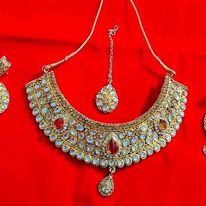 Kundan Necklace With Matching Earrings And Tika