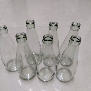 7 Empty Glass Bottles