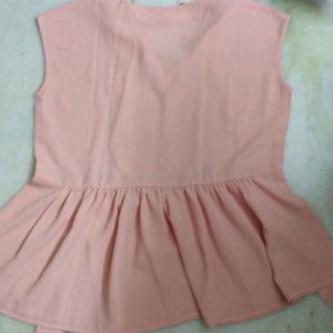 PEACH TIE UP AND PEPLUM TOP