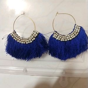 medium sized ear rings with blue threads