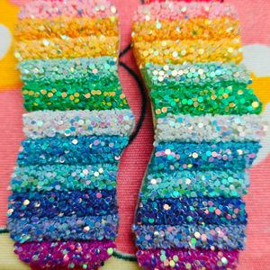 A Pair Of Glittery Rainbow Clips