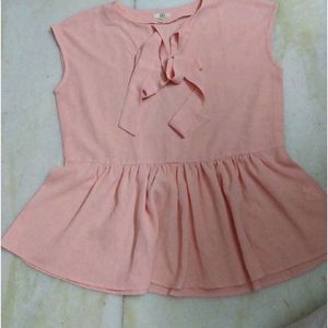 PEACH TIE UP AND PEPLUM TOP