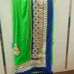 A Green Saree With Blue Border