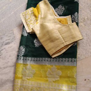 A Bottle Green Colour Saree With Yellow Border