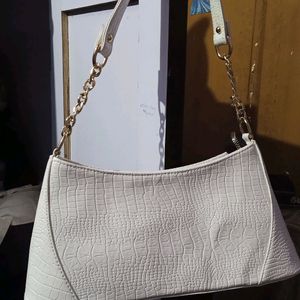 white shoulder/sling bag