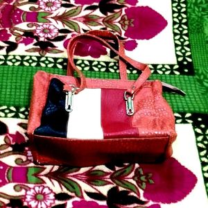 IT IS A PINK COLOR WOMEN'S LEATHER BAG.......