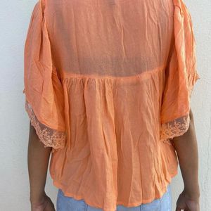 Beautiful Orange Top With Unique Hand Design