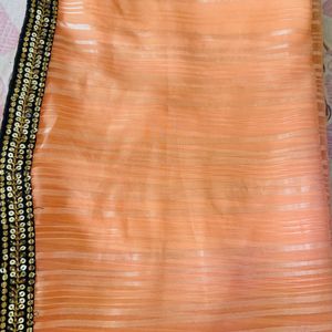 Orange sari with blouse sequence border