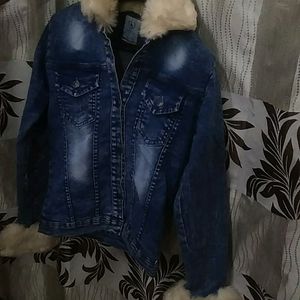 A Denium Jacket Pair With Blue Jeans