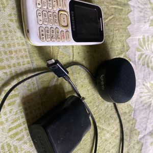 Phone , Charger And Speaker