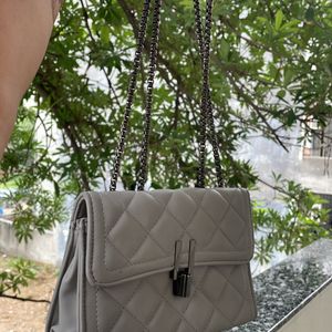 Grey sling Clutch With Stylish Lock