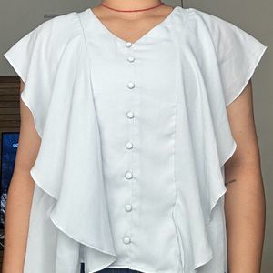 light blue frilled top