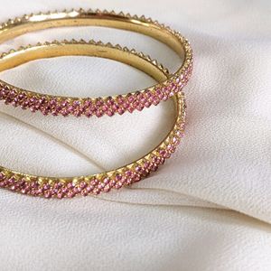 A Rose Gold Bangle With Ros Stones