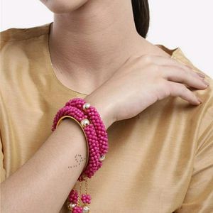 2 Pink & Gold-Toned Beaded Bangles with Latkan