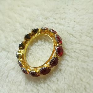 A Beautiful Golden Ring With Red Diamonds