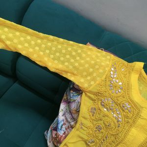 Yellow Chikankari Kurta And White Flared Palazzo