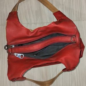 Beautiful Red Coloured Hand Bag In Good Condition