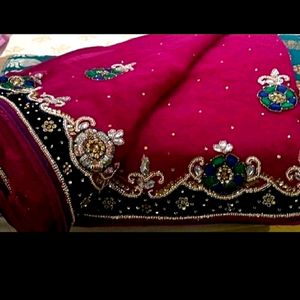 Beautiful heavy embroidered Rani pink saree