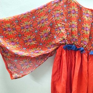 Printed Orange Top With Cut-out Cape Sleeves