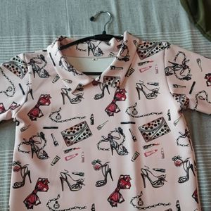 Women Baby Pink Top With Printed Feminine Graphic