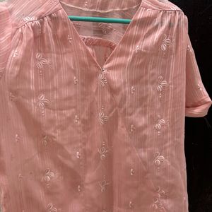 A Pretty Peach Top With Delicate Embroidered Motif