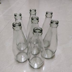 7 Empty Glass Bottles