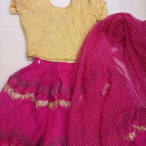 golden choli and dark pink ghaghra with duppatta