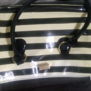 white and black strip handbag