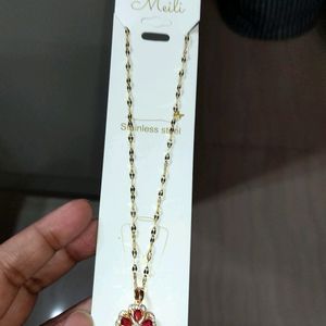 A Gold Plated Chain With Stylish Red Stone Locket