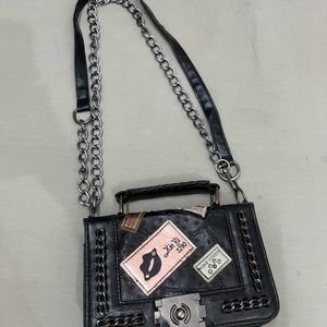 Punched Black Sling Bag.