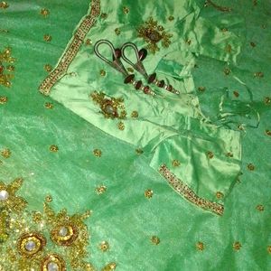Net Saree With Blouse In Green Colour
