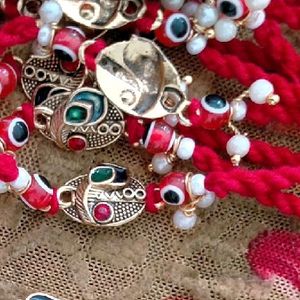 RAKHI with Morpankh, Red Evil Eye & Pearls